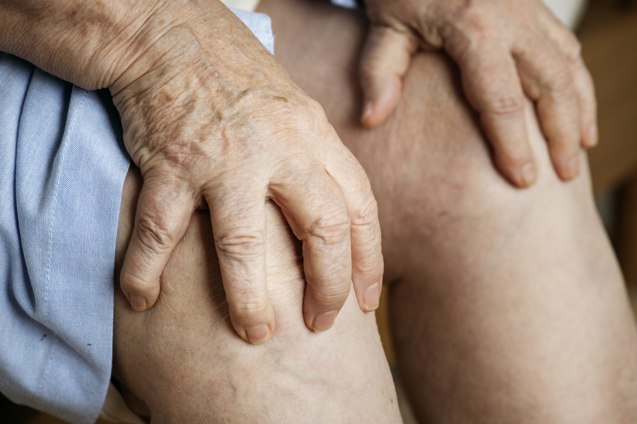 Elderly woman suffering knee pain Elderly woman suffering knee pain