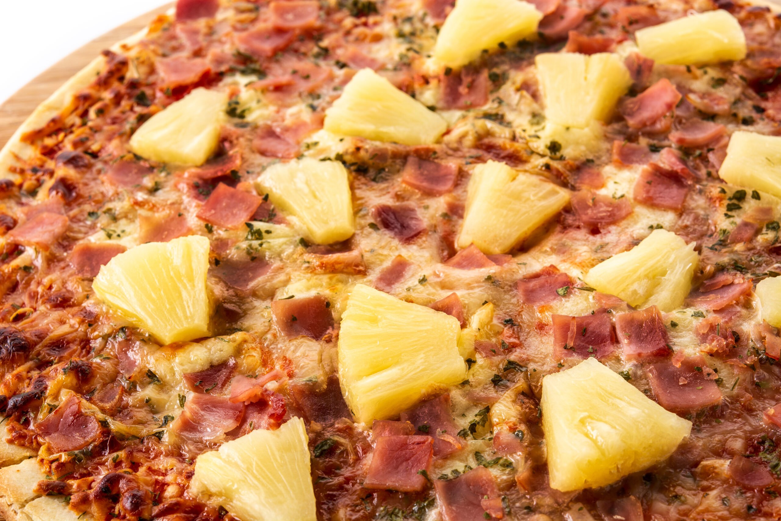 Hawaiian pizza with pineapple,ham and cheese Hawaiian pizza with pineapple,ham and cheese isolated on white background